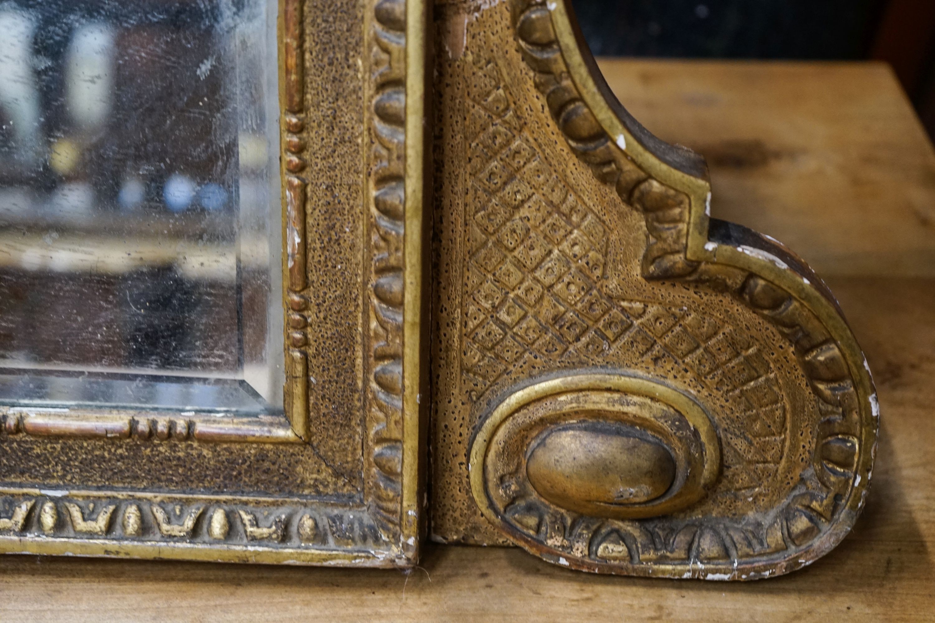 A 19th century giltwood and gesso triple plate overmantel mirror, width 164cm, height 49cm